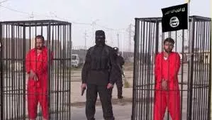 A masked person in black holding a gun between two people in red outfits behind cages.
