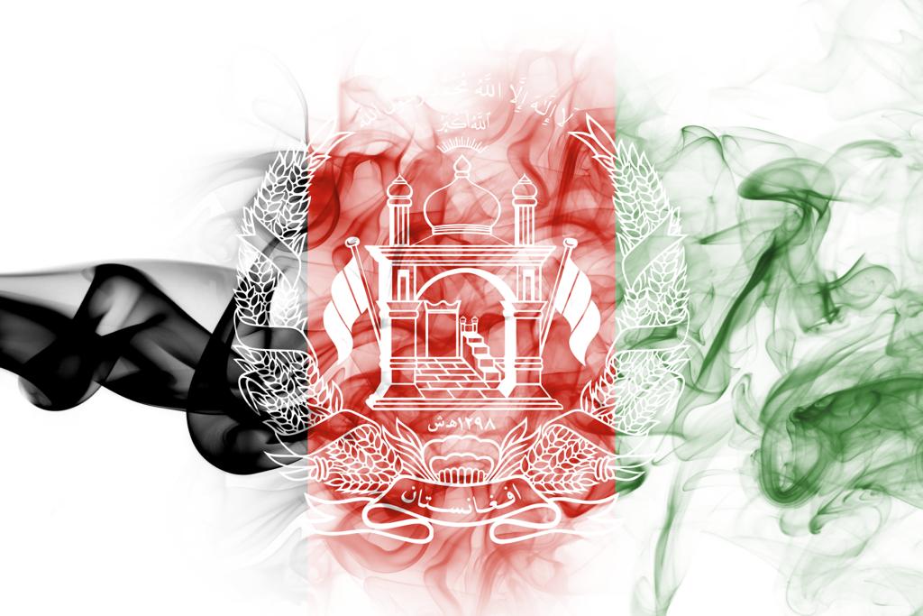 Artistic smoke art blending black, white, red, and green colors.