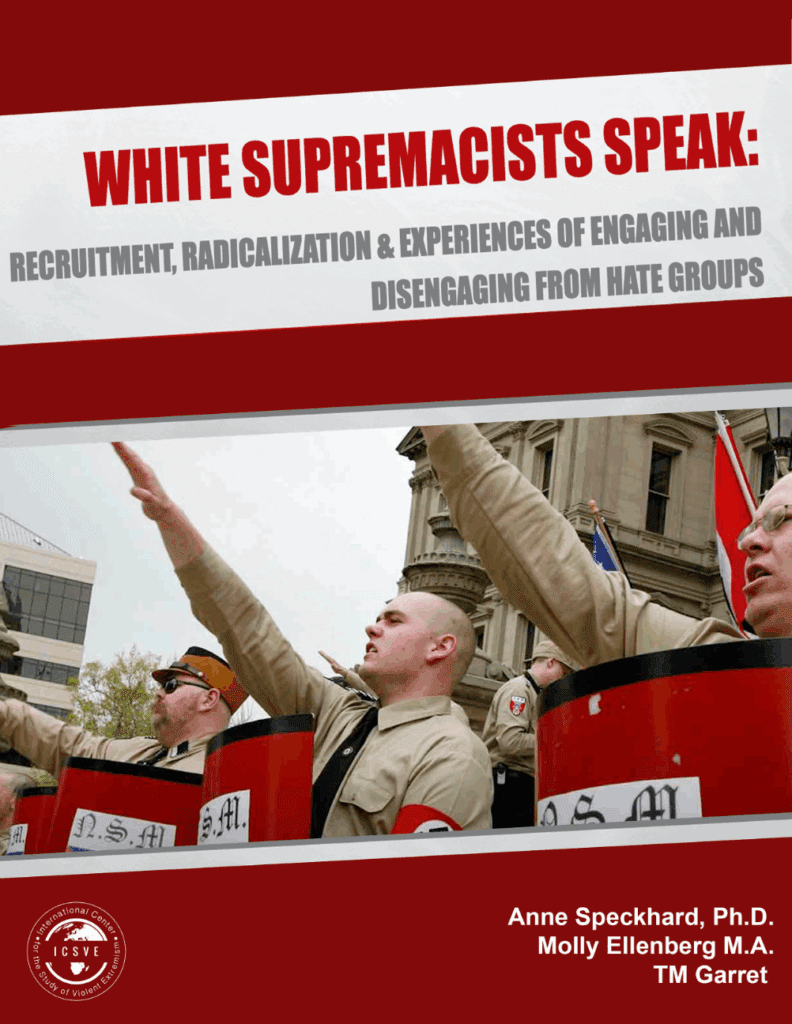 White supremacists giving Nazi salutes at a rally.