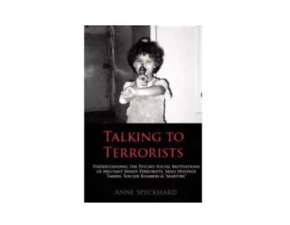 Book cover of "Talking to Terrorists" by Stuart Rees and others, featuring a black and white photo of a man with crossed arms.