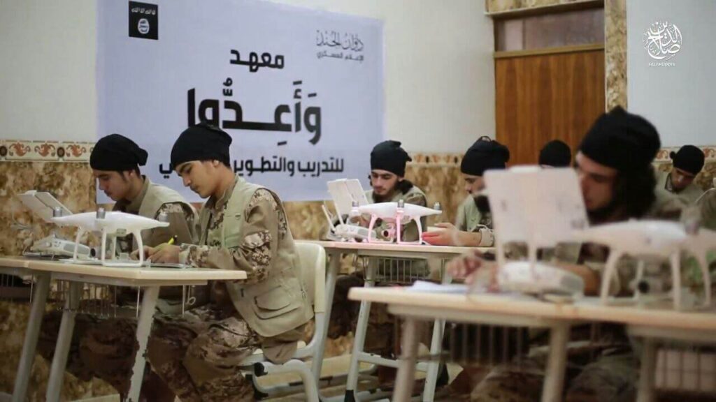 Students in military uniform taking an exam in a classroom.