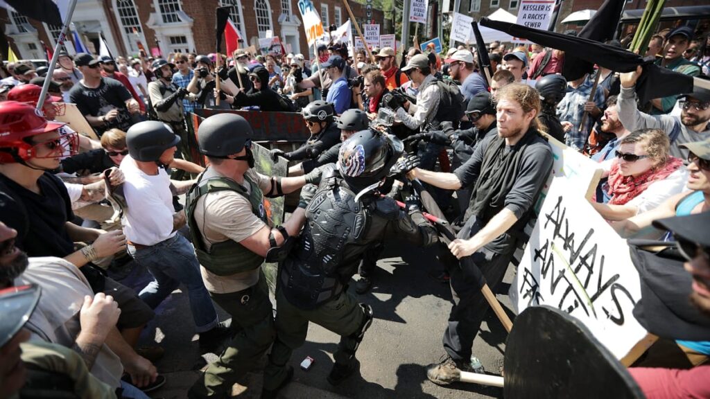 Clash between protesters and counter-protesters amid tense confrontation.