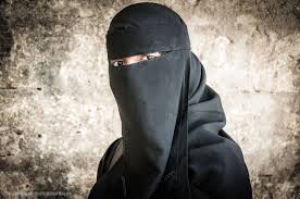 Portrait of woman wearing black niqab