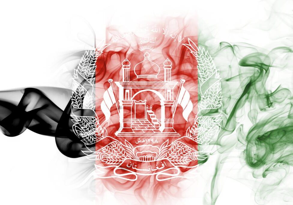 Artistic smoke art blending black, white, red, and green colors.