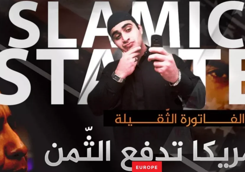 A man in a beanie posing in front of a bold Arabic and English text backdrop.