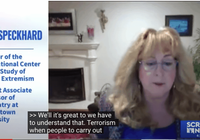Woman speaking in a webinar about terrorism and court processes.