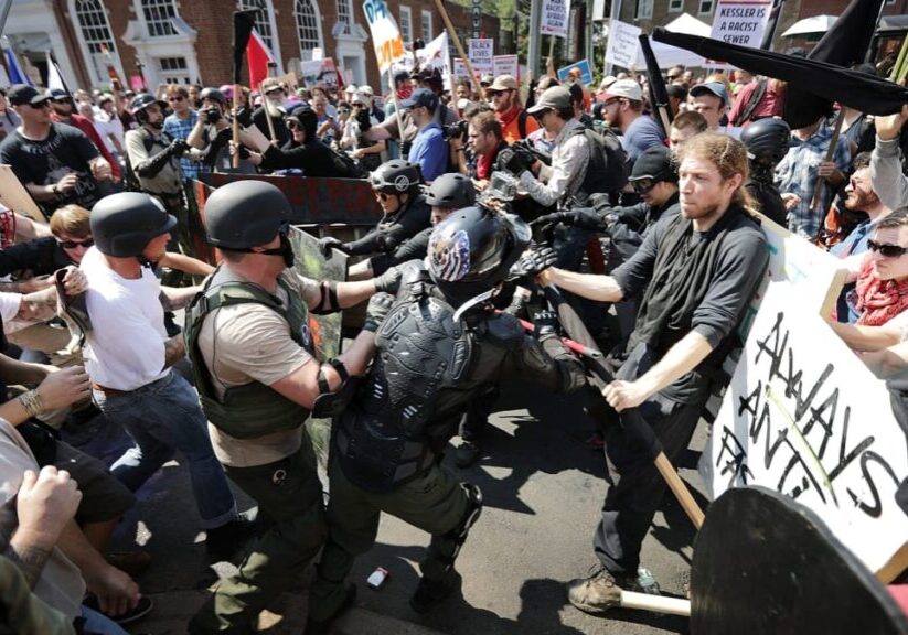 Clash between protesters and counter-protesters amid tense confrontation.