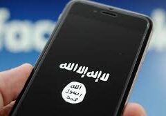 A smartphone screen displaying extremist group ISIS's flag.