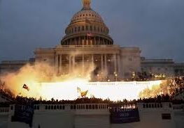 Fire engulfing area near the Capitol building at night.